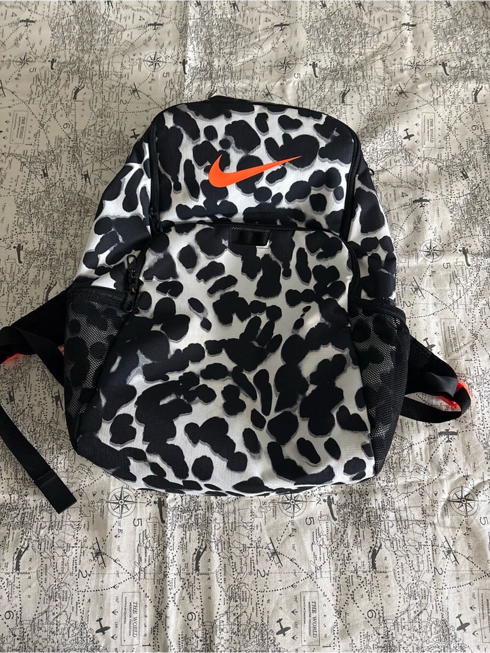 Nike Black and White Spot Pattern Backpack with Orange Swoosh